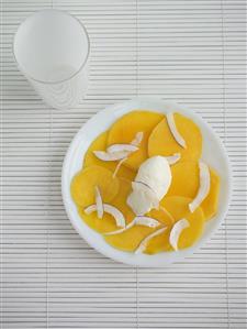 Mango carpaccio with strips of coconut & coconut ice cream