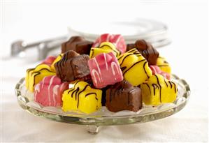Assorted petit fours on cake stand