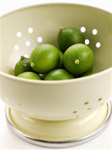Limes in a colander