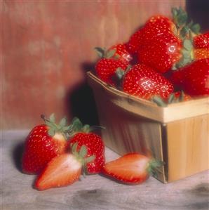 Strawberries in a Pint Basket; One halved