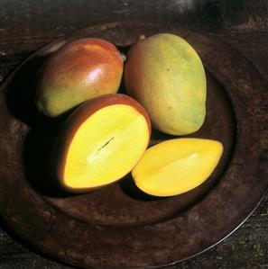 Mangoes on a Plate; One Sliced