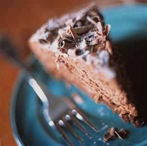 Slice of Mocha Cake Topped with Chocolate Curls