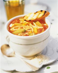 A Bowl of Minestrone Soup with Grilled Bread