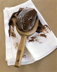 A Spoonful of Chocolate Frosting; White Napkin