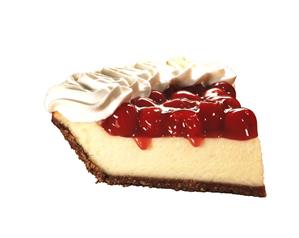 A piece of cheesecake with cherries and cream