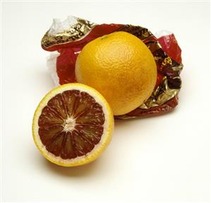 One Whole Blood Orange with Another Cut in Half