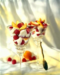 Raspberry and peach dessert in glasses