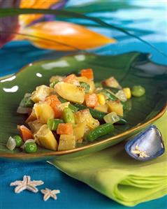 Vegetable salad with figs on leaf-shaped plate