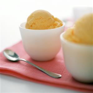 Orange sorbet in white cups