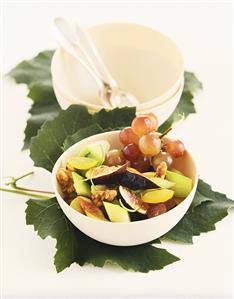 Fruit salad with figs, melon, grapes and walnuts