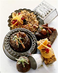 Various Fruit Cakes and Pans on a White Background