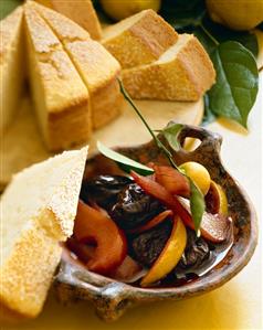 Small Bowl of Poached Fruit with a Slice of Pound Cake; Slices of Cake