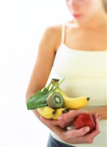 A Woman Holding Fruit