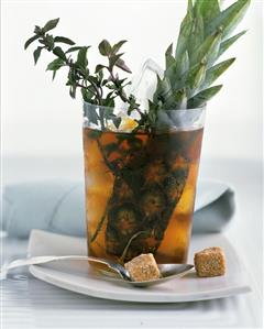 Iced tea with pineapple and brown sugar