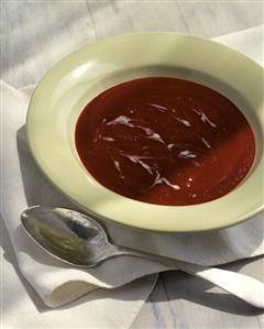 Beetroot soup with cream stripes