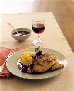 Chicken with blackberry sauce & apricot rice; red wine glass