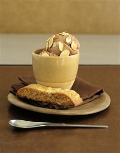 Chocolate ice cream with nuts and a piece of nut cake