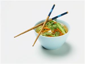 Small Bowl of Asian Vegetable Soup with Chopsticks