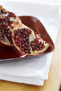 A Pomegranate in a Wooden Bowl