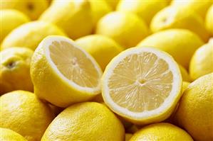 Many Whole Fresh Lemons; One Halved