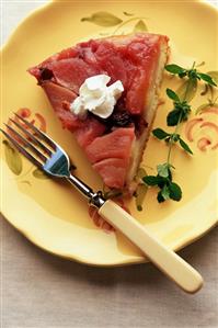 Slice of Apple Upside Down Cake with Whipped Cream; On Yellow Plate; Fork