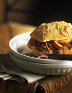 Pulled Beef Sandwich with Peaches on a Crusty Cheese Roll