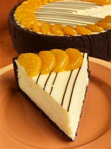 Slice of Orange Cheesecake with Chocolate Graham Cracker Crust