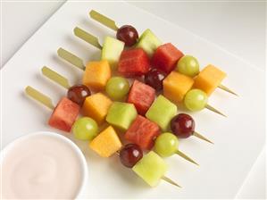 Fruit Skewers on a Plate with Raspberry Yogurt Dip