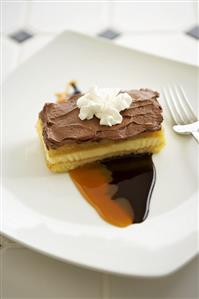 Piece of Boston Cream Pie with Chocolate and Caramel Sauce