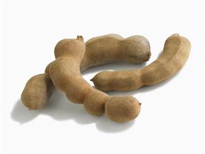 Three Tamarind Pods on White