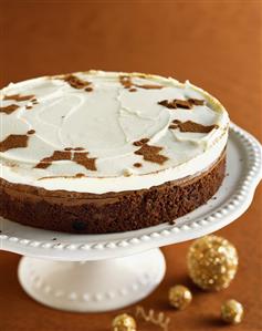 Chocolate Christmas Torte with Cocoa Powder Holly Decoration