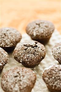 Mini Brownie Muffins Topped with Powdered Sugar