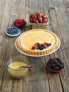 Tart with a Few Berries Placed On Top for Topping; Fresh Mixed Berries