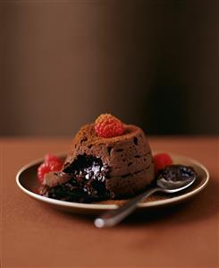 Molten Chocolate Cake with Raspberries; Broken Open with Spoon