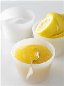 Lemon curd with sugar and squeezed lemons