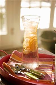 Tall Pitcher of Lemonade on a Tray with Spoons