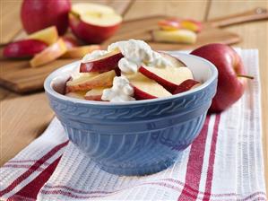 A Bowl of Apple Slices with Cottage Cheese