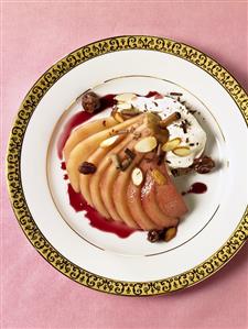 Poached Pear in Pomegranate Sauce; Sliced Almonds and Raisins