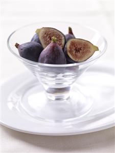 Whole and Halved Figs in a Glass Bowl