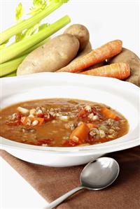 Bowl of Lentil Soup with Fresh Vegetables