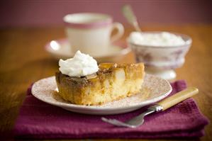 Slice of Pear Cake with Whipped Cream