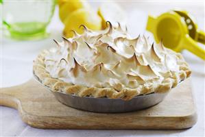 Lemon Meringue Pie with Lemons in Background