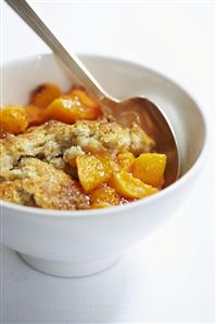 Bowl of Peach Cobber Made with Organic Elberta Peaches