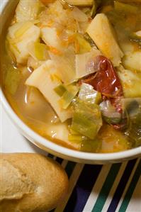 Bowl of Vegetable Soup with Baguette