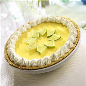 Key Lime Pie with Limes and Whipped Cream