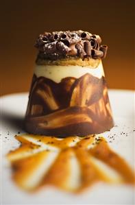 Layered Dessert Topped with Chocolate Curls