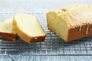 Partially Sliced Lemon Pound Cake on Rack