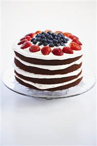 Four Layer Red Velvet Cake with Strawberries and Blueberries