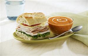 Turkey Sandwich with a Bowl of Tomato Soup