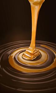 Caramel Sauce Pouring into Swirled Chocolate and Caramel